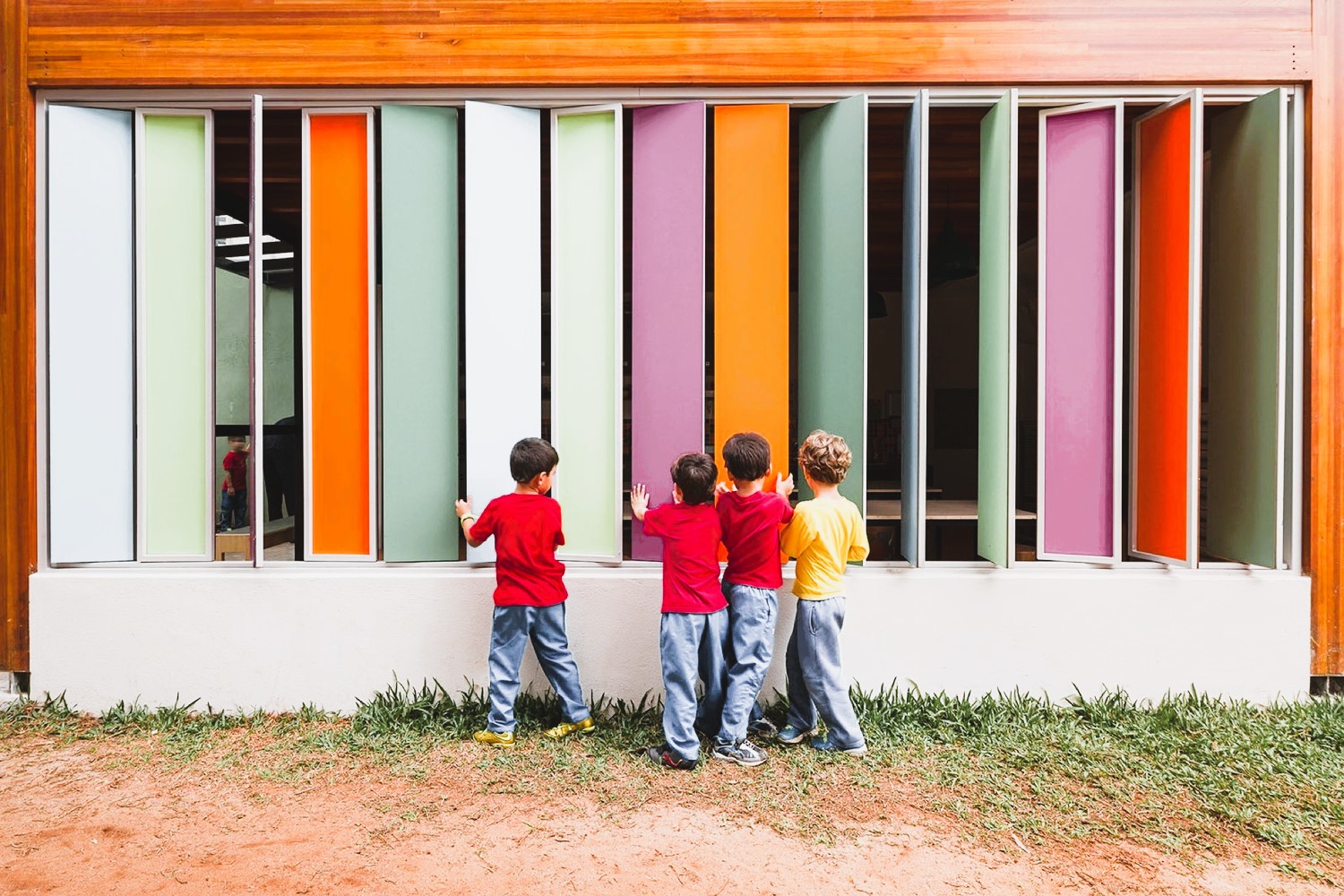 Children near the colorful wall